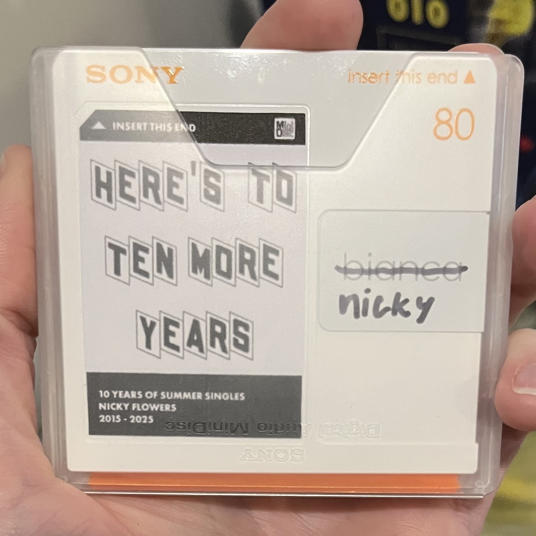 Photo of the disc’s label, reading “Here’s to Ten More Years”
