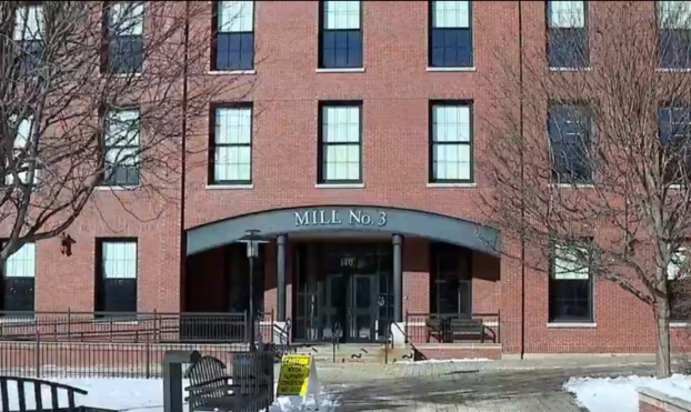 A photo of the brick front of Bates Mill in Lewiston, Maine.