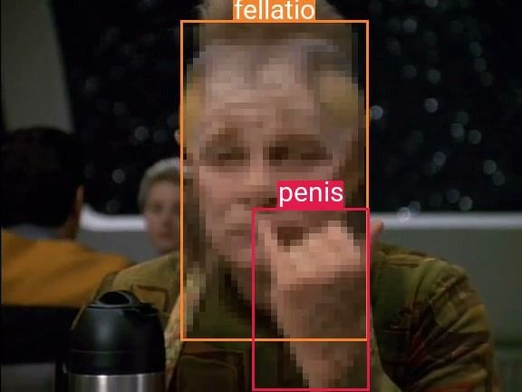 A screencap of Star Trek Voyager, showing Neelix, with the NSFW model marking his hand as a penis, and since he has it held up to his head, it marked his head as fellatio